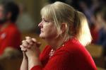 Woman prays for victims of factory explosion